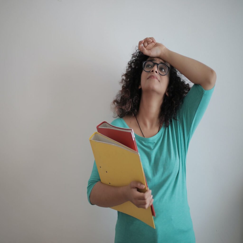 woman having a headache due to her school lessons