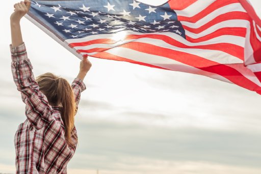 young beautiful woman holding USA flag